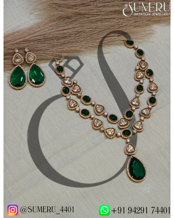 MOISSANITE SET WITH GREEN A.D. STONE