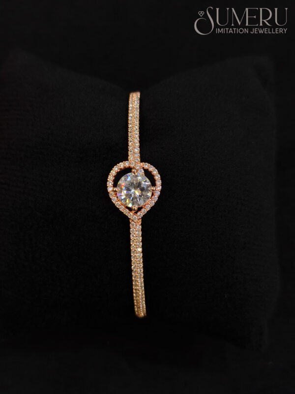 A.D. KADA IN ROSE GOLDE TONE WITH WHITE STONE