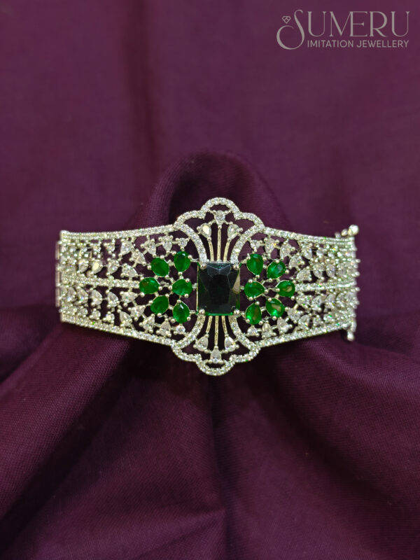 A.D. KADA IN SILVER TONE WITH GREEN STONE