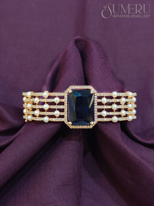 A.D. KADA IN ROSE GOLD WITH BLUE STONE AND PAL